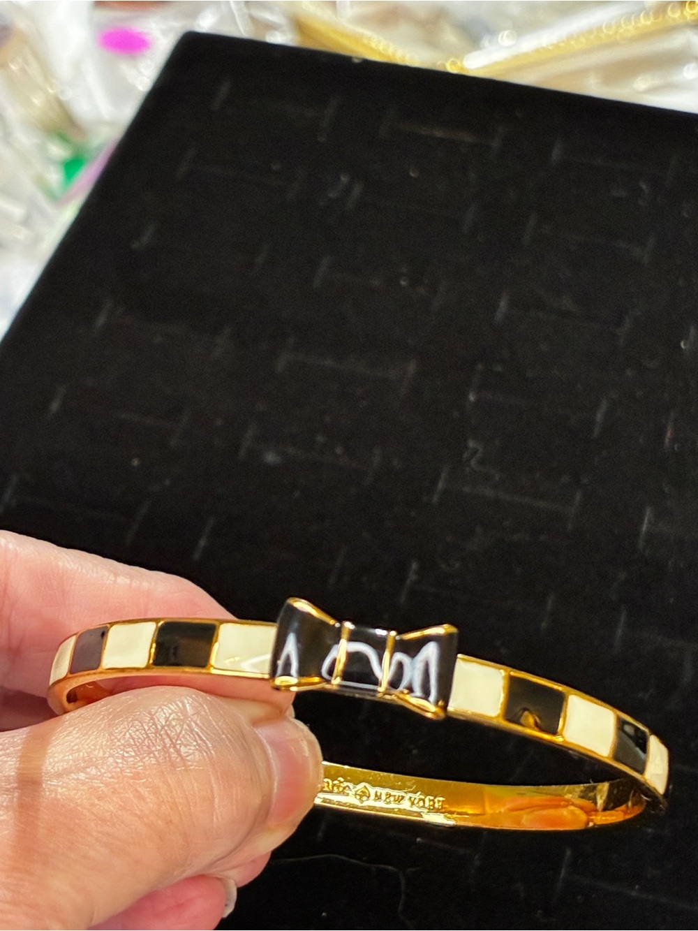 Gold Tone Bow Bangle Bracelet with Black and Cream Enamel